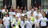 Teachers and children outside the door of No 10 Downing Street