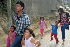 Young Ambassadors skipping down the street with young children