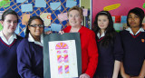 Woman and school girls with door artwork