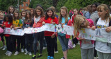 Children displaying scarf artwork