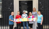 Teacher and children at 10 Downing Street