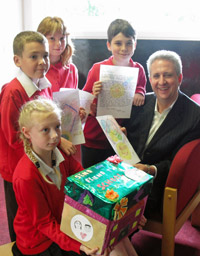 Pupils from St John's School met MP Ivan Lewis at his constituency office to deliver their Go for Gold education messages