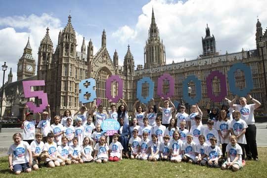 Over 50 children outside the UK Houses of Parliament calling for action to send every child to school.